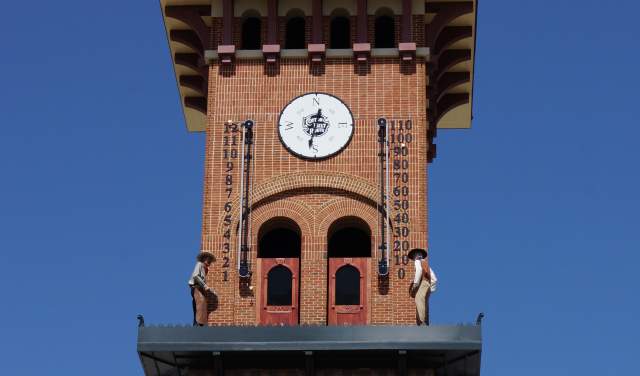 would be train robbers emerging from clock tower