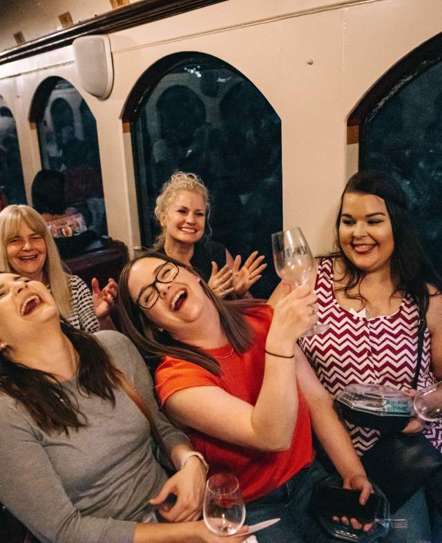 friends laughing on the jazz wine train