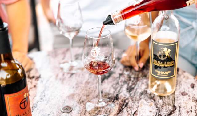 wine being poured into a glass