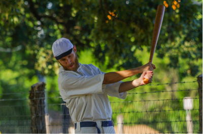 Man playing baseball in vintage uniform