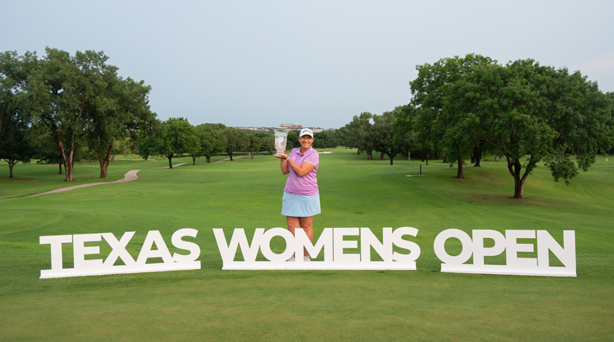 Angela Stanford holding Texas Women's Open trophy for Legends division